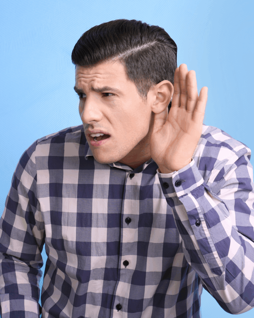 απώλεια ακοής young man with difficulty in hearing